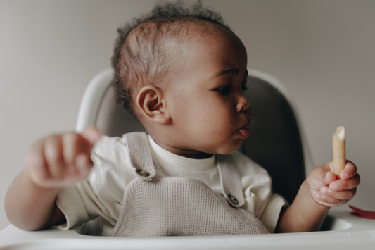Baby eating nut powder–infused puree – tree nut introduction with Allermix