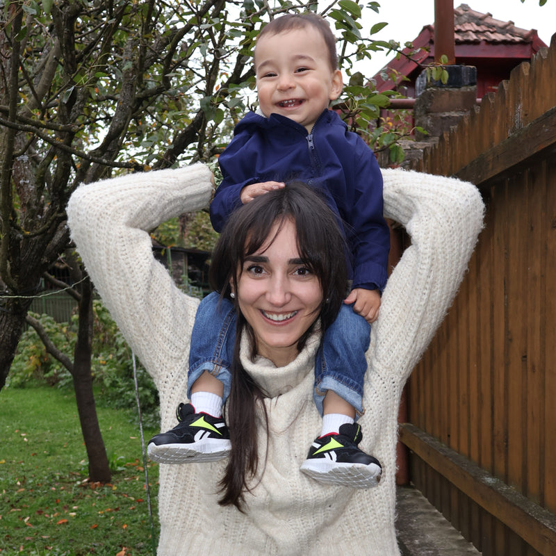Allermix co-founder Helena Zhu smiling with a baby